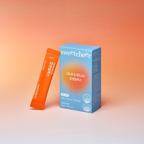 A clean, high-contrast studio shot of a relaxation supplement box and single-serving sachet on a gradient background.